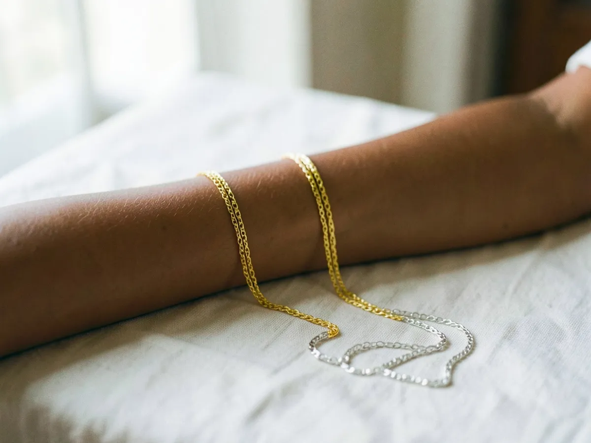 Gold and silver jewelry compared against bare skin — the jewelry test for warm vs. cool undertone